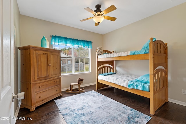 bedroom featuring ceiling fan and dark hardwood / wood-style floors