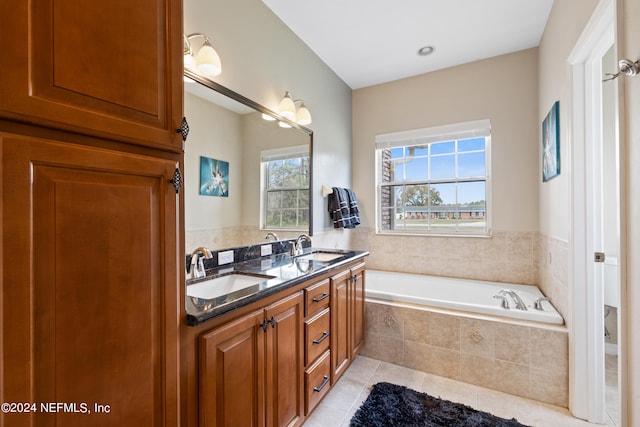 bathroom with a relaxing tiled bath, tile flooring, and dual vanity