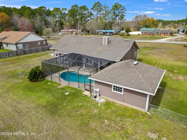 view of pool featuring a lawn