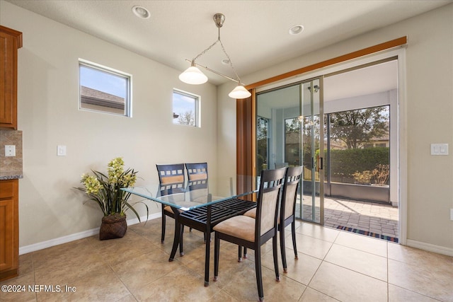 dining space with light tile patterned flooring