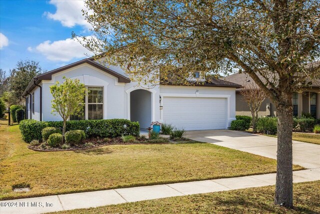 view of front facade with a front lawn and a garage