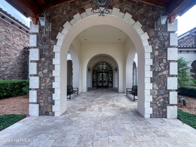 property entrance with french doors and a patio area