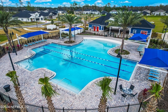 view of swimming pool with a patio