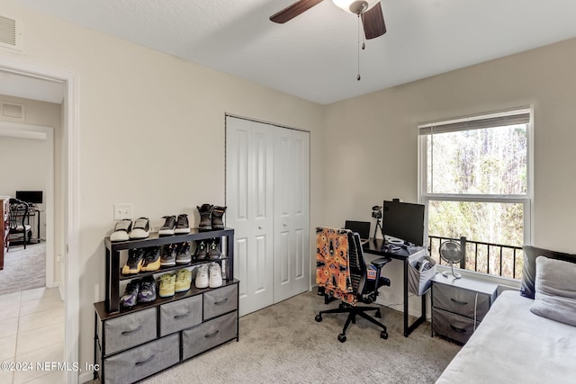 office featuring ceiling fan and light tile flooring