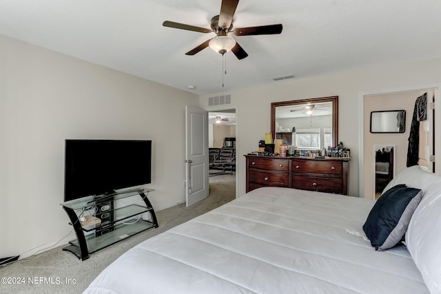 bedroom with ceiling fan and light colored carpet