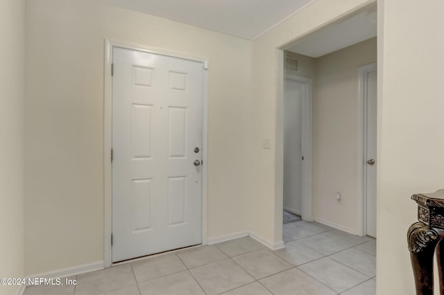 entryway featuring light tile floors