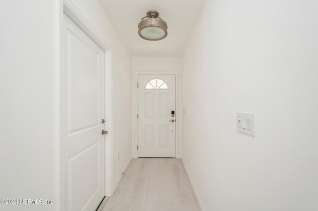 entryway with light hardwood / wood-style flooring