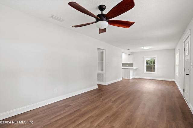 empty room featuring dark hardwood / wood-style floors and ceiling fan