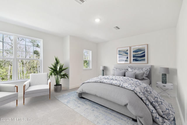 bedroom featuring carpet floors, baseboards, and visible vents