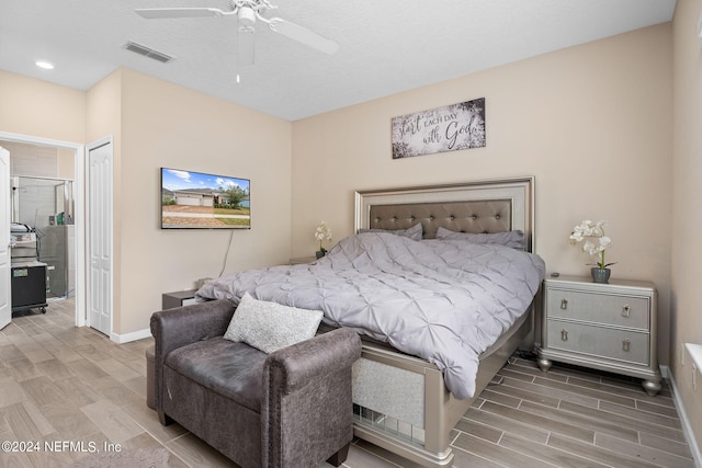 bedroom featuring a closet, ceiling fan, and light hardwood / wood-style flooring