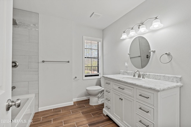 full bathroom with vanity, toilet, and tiled shower / bath