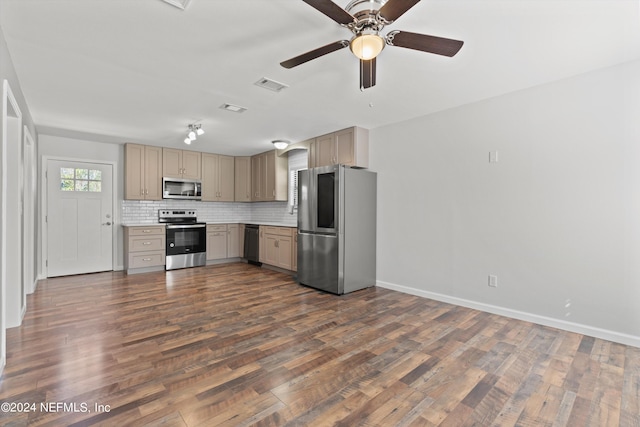 kitchen featuring backsplash, dark hardwood / wood-style flooring, stainless steel appliances, and ceiling fan