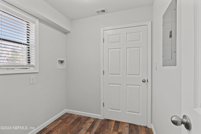 interior space featuring dark hardwood / wood-style flooring and hookup for a washing machine