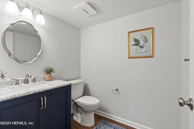 bathroom with toilet and vanity