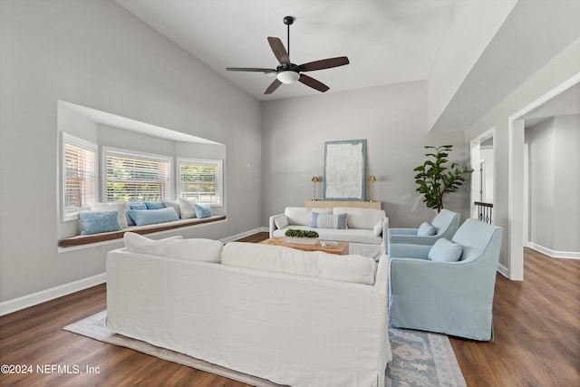 living room with dark hardwood / wood-style floors and ceiling fan