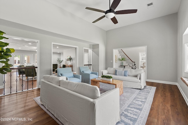 living room featuring dark hardwood / wood-style flooring and ceiling fan