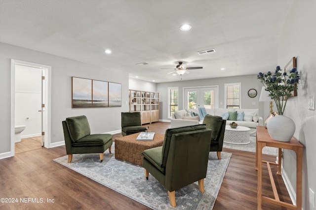 living room with french doors, light hardwood / wood-style flooring, and ceiling fan