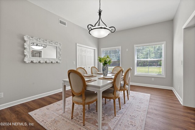 dining area featuring dark hardwood / wood-style floors