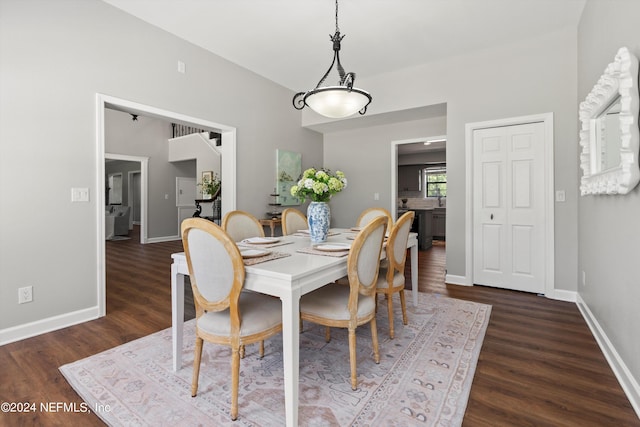 dining area with dark hardwood / wood-style floors