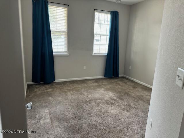 spare room with carpet