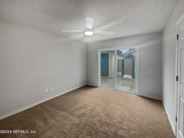 unfurnished room with light carpet, a textured ceiling, and ceiling fan