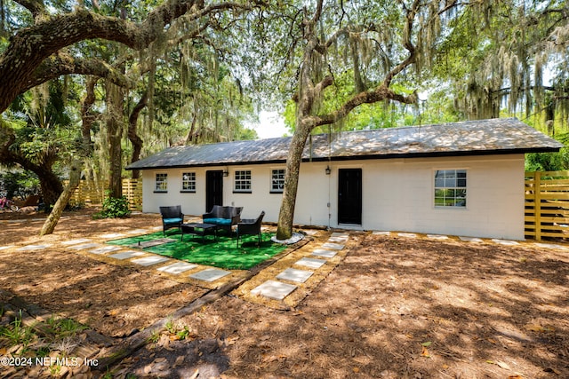 view of front of home featuring an outdoor hangout area and a patio area