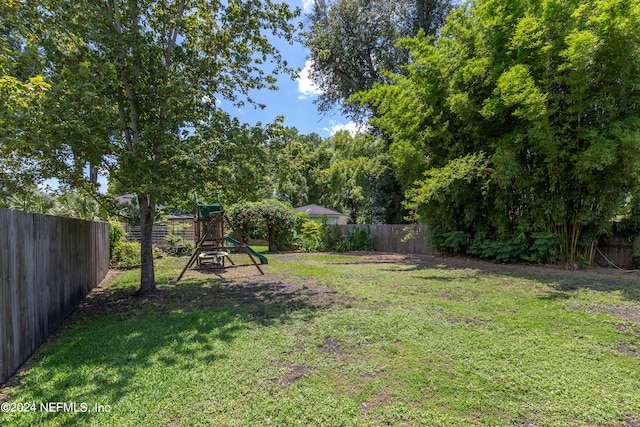 view of yard with a playground