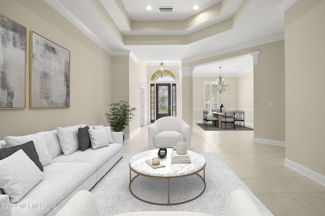 living area featuring an inviting chandelier, a raised ceiling, decorative columns, and visible vents