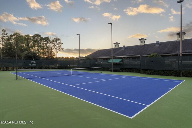 view of sport court with fence