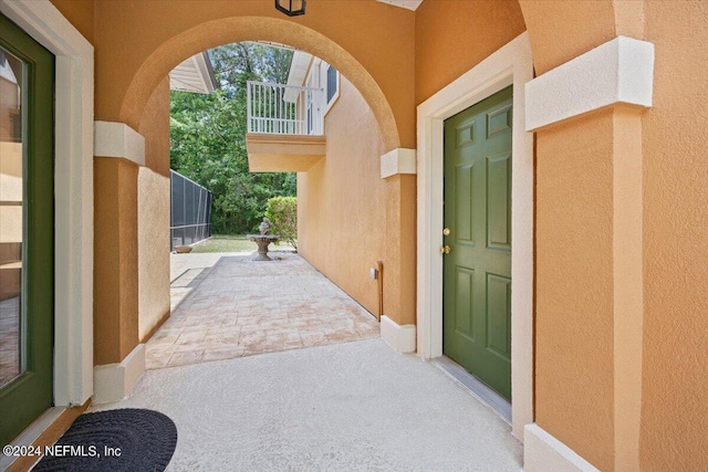 view of exterior entry with stucco siding