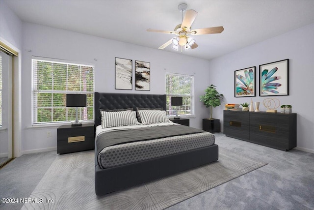 bedroom featuring a ceiling fan, baseboards, and carpet flooring