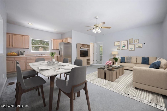 carpeted dining area featuring a ceiling fan, recessed lighting, visible vents, and a sink