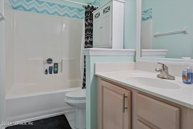 full bathroom featuring toilet, tile patterned flooring, shower / bath combo with shower curtain, and vanity