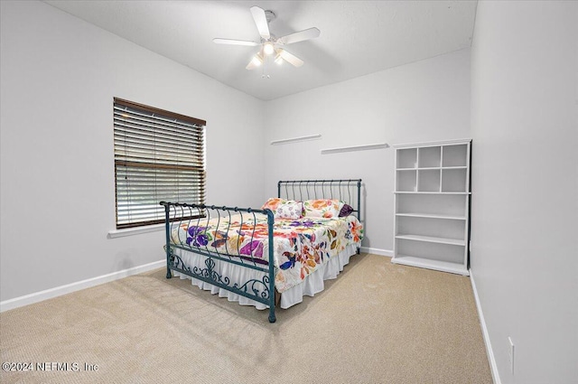 bedroom featuring carpet, baseboards, and ceiling fan