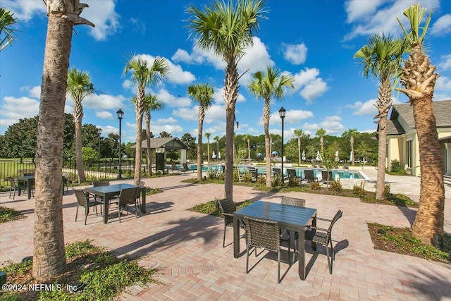 view of patio / terrace with a gazebo and a community pool