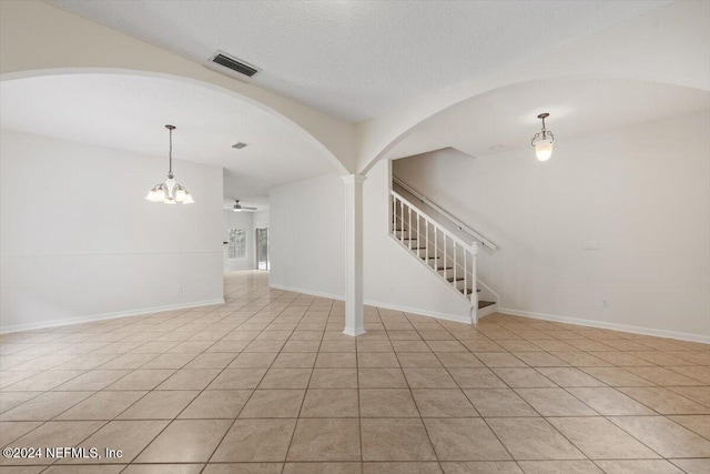 interior space featuring light tile patterned floors and vaulted ceiling