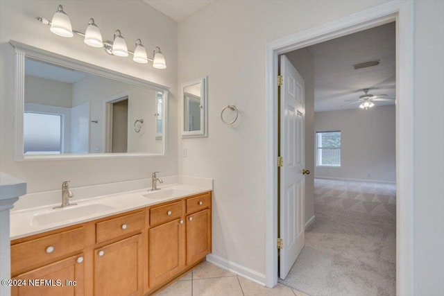 bathroom featuring tile patterned flooring, vanity, and ceiling fan