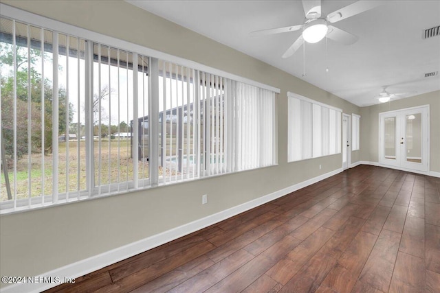 unfurnished sunroom with french doors and ceiling fan