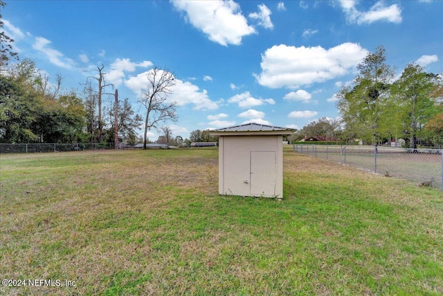 view of shed / structure featuring a yard