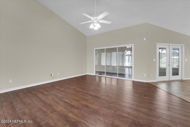 spare room featuring high vaulted ceiling, dark hardwood / wood-style floors, and ceiling fan