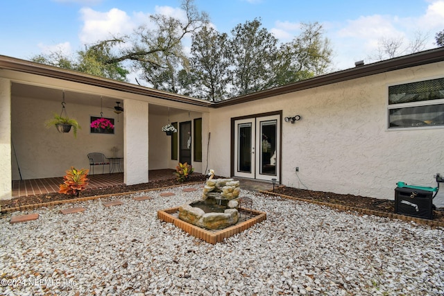 rear view of property featuring french doors