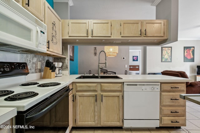 kitchen featuring light tile patterned flooring, sink, kitchen peninsula, white appliances, and crown molding