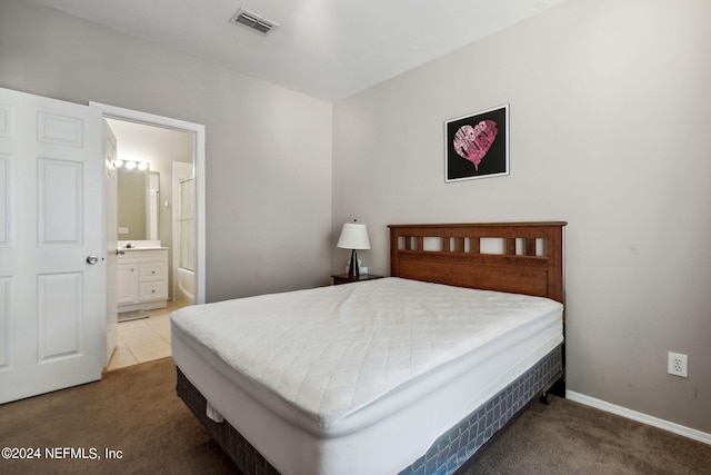 bedroom featuring carpet floors and ensuite bathroom