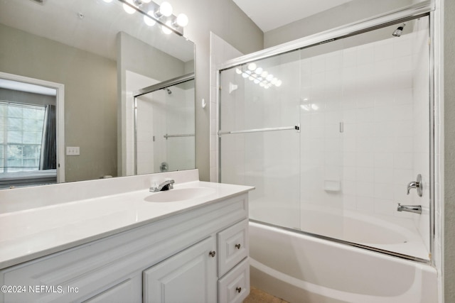 bathroom featuring vanity and enclosed tub / shower combo