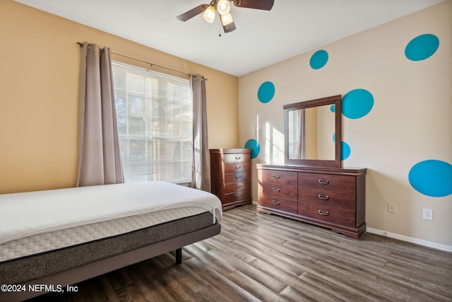 bedroom featuring ceiling fan and hardwood / wood-style flooring