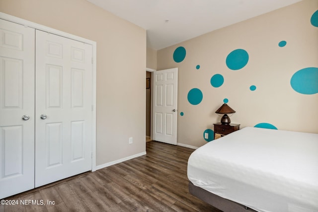 unfurnished bedroom with a closet and dark wood-type flooring