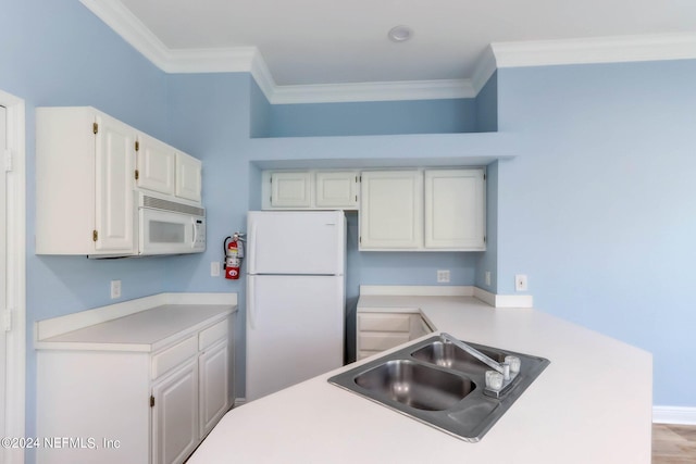 kitchen featuring white cabinetry, white appliances, light wood-type flooring, ornamental molding, and sink