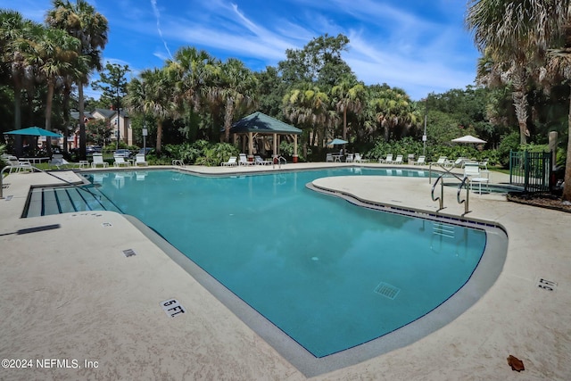 view of swimming pool with a patio area and a gazebo