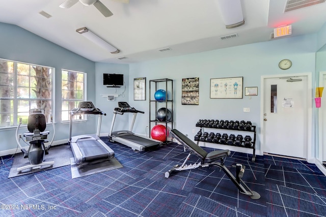 gym with lofted ceiling and ceiling fan