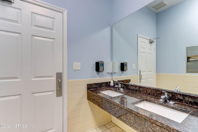 bathroom with tile patterned flooring and vanity